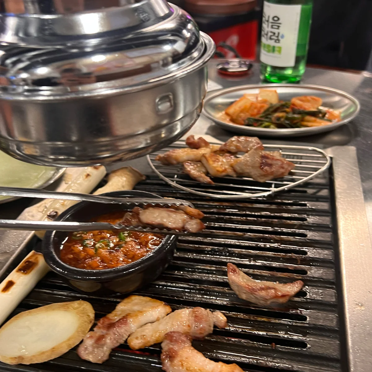 Enjoying pork belly and specialty stew at Mungteong